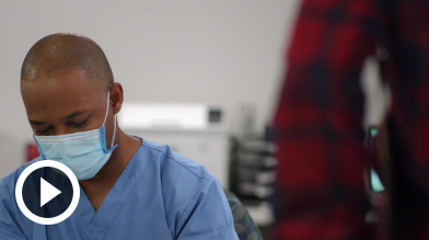 prepping for hospital stay medical worker in hospital mask